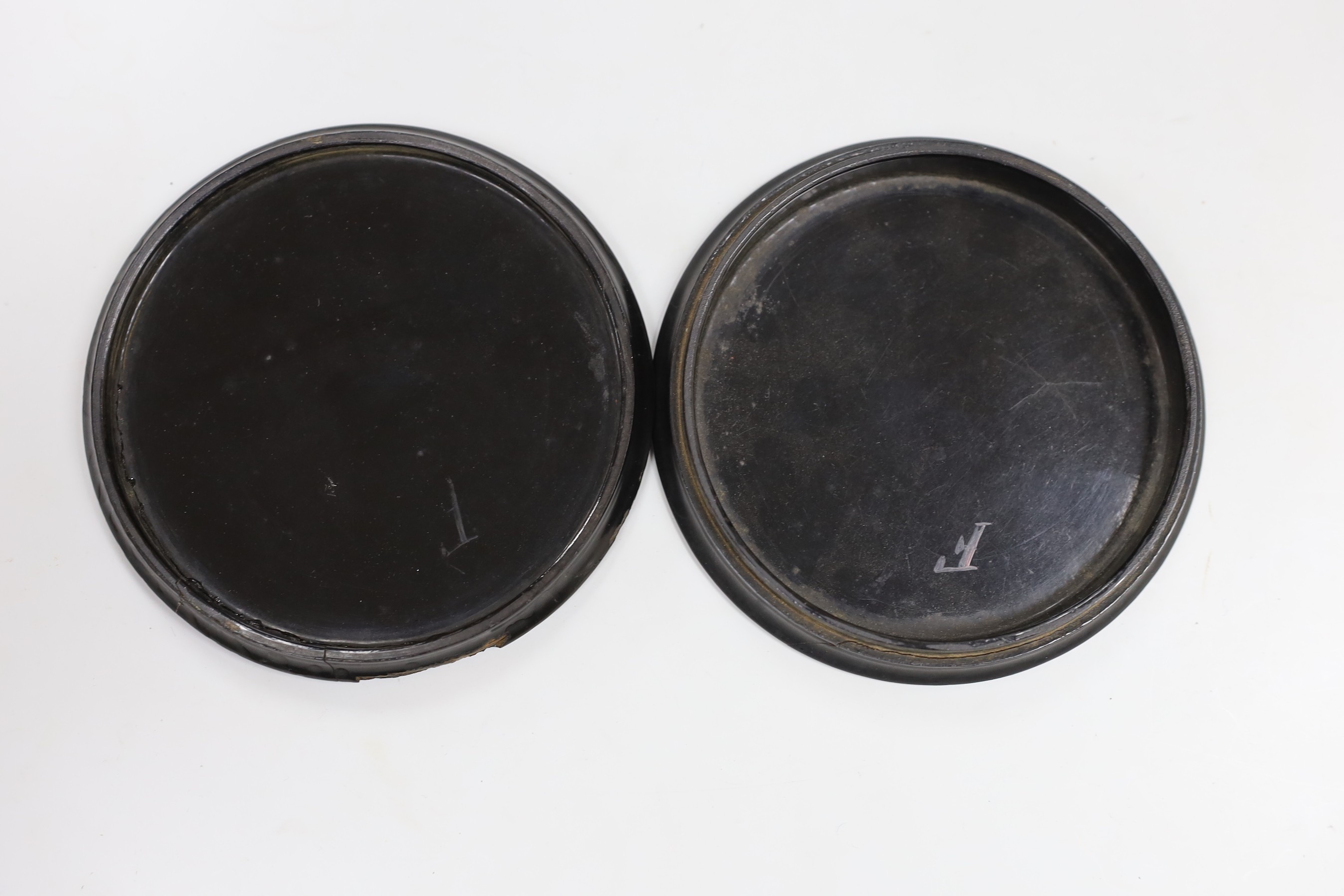 A 19th century papier mache box with a painting of a 19th century naval officer, 12cm diameter